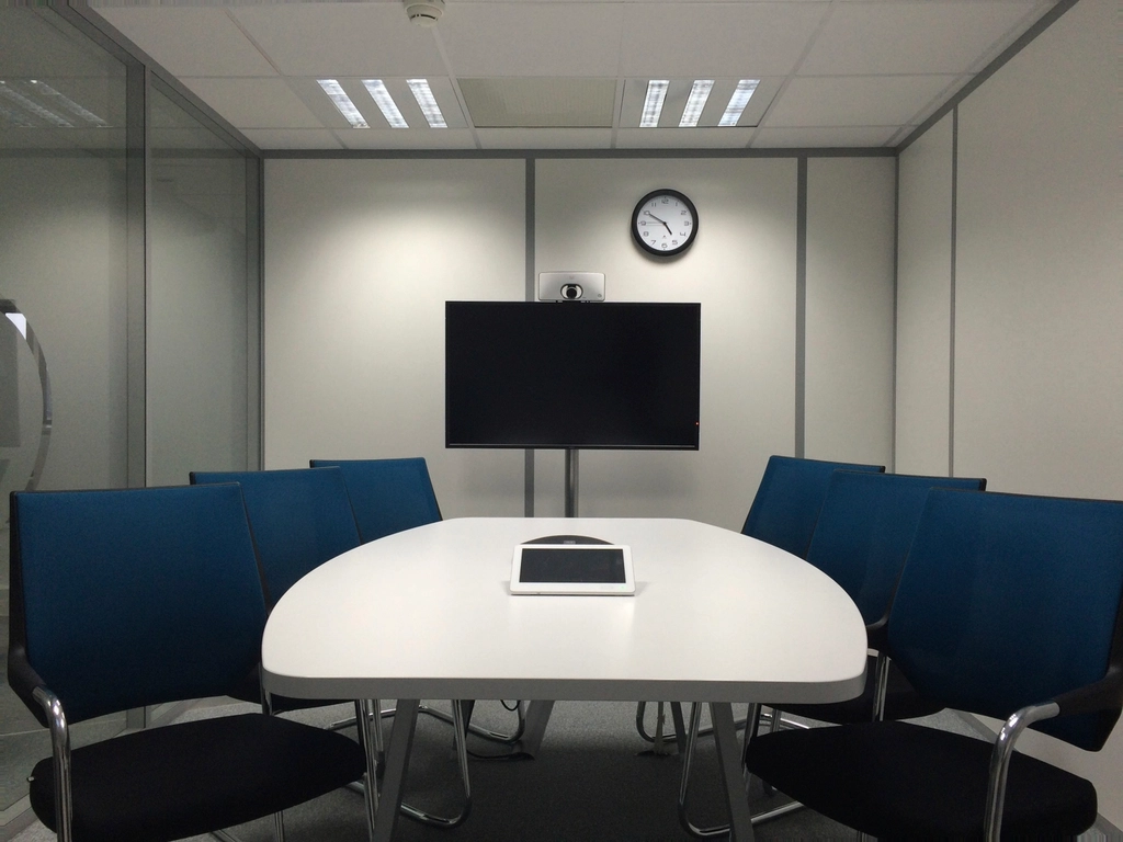 Empty corporate boardroom with a long table